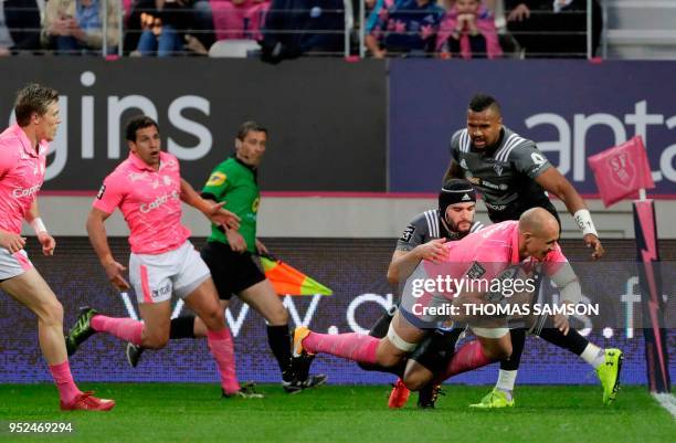 Stade Francais's Italian number eight Sergio Parisse dives to score a try during the French Top 14 rugby union match between Paris Stade Francais and...