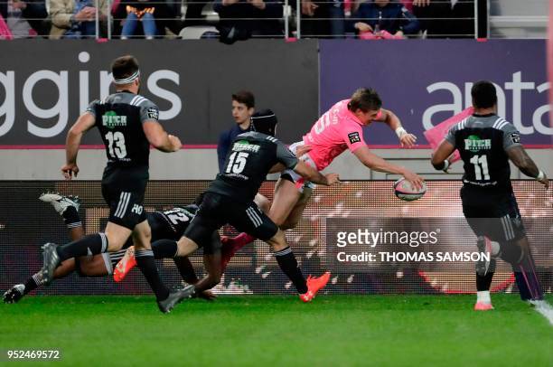 Stade Francais' New Zealand wing Tony Ensor dives to score a try, that was not allowed, during the French Top 14 rugby union match between Paris...