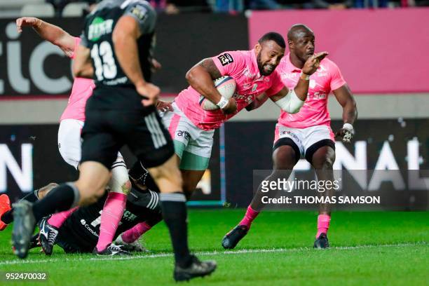 Stade Francais' Fijian winger Waisea Nayacalevu is tackled during the French Top 14 rugby union match between Paris Stade Francais and Brive CAB on...
