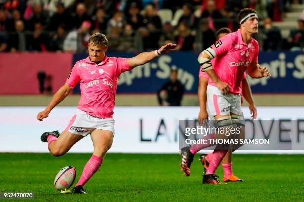 Stade Francais' French fly-half Jules Plisson kicks a penalty during the French Top 14 rugby union match between Paris Stade Francais and Brive CAB...