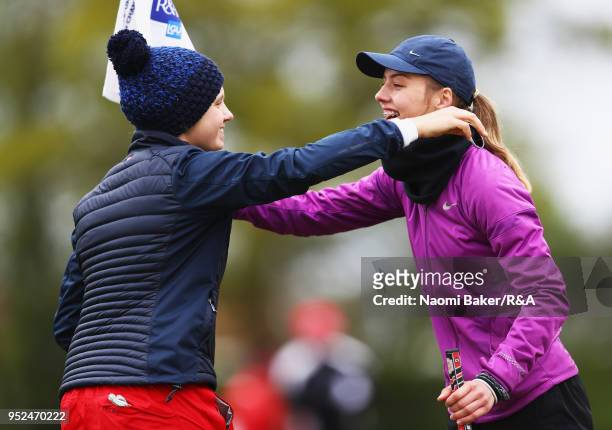 Elena Moosmann embraces Chloe Gibbs on the 18th green during the second round of the Girls' U16 Open Championship at Fulford Golf Club on April 28,...