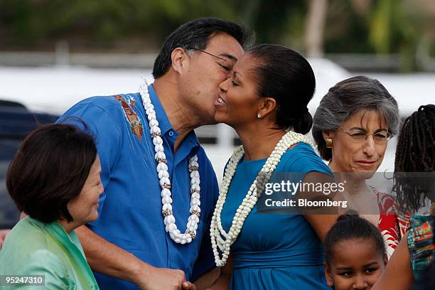 Honolulu mayor Mufi Hanneman and Congresswoman Mazie Hirono, left, greet U.S. First Lady Michelle Obama at Hickam Air Force Base in Honolulu, Hawaii,...