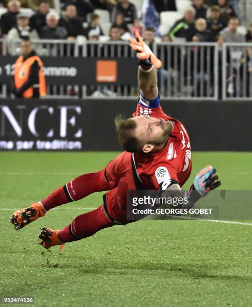 Dijon's French goalkeeper Baptiste Reynet jumps to catch the ball during the French L1 football match between FC Girondins de Bordeaux and Dijon FCO...