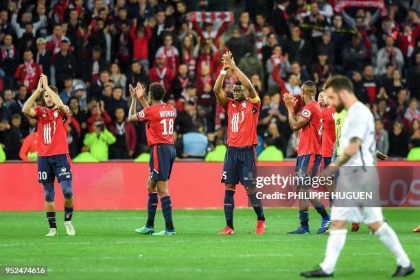 Lille's team players celebrate at the end of the French L1 football match between Lille and Metz on April 28 2018 at the Pierre Mauroy Stadium in...