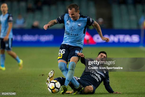 Sydney FC defender Luke Wilkshire is fouled by Melbourne Victory forward Christian Theoharous at the A-League Soccer Semi Final Match between Sydney...