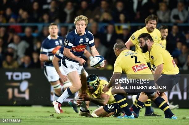 Agen's Australian flyhalf Jake Mc Intyre runs with the ball during the French Top 14 rugby union match between SU Agen and ASM Clermont on April 28,...