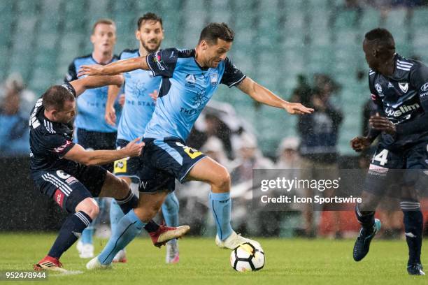Sydney FC forward Bobo breaks the tackle of Melbourne Victory defender Leigh Brougham at the A-League Semi-Final Soccer Match between Sydney FC and...