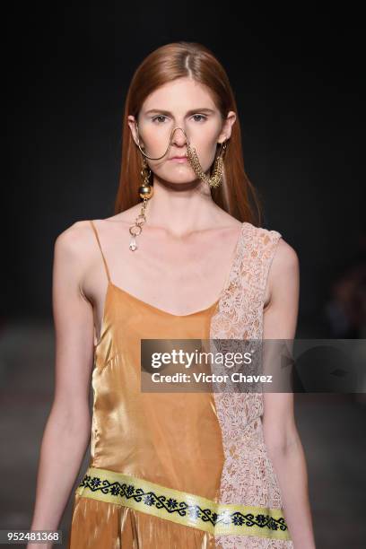 Model walks the runway during the Armando Takeda show at Mercedes Benz Fashion Week Mexico Fall/Winter 2018 at Fronton Mexico on April 26, 2018 in...