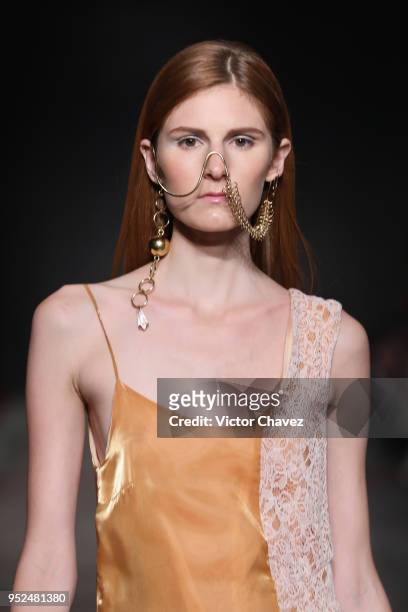 Model walks the runway during the Armando Takeda show at Mercedes Benz Fashion Week Mexico Fall/Winter 2018 at Fronton Mexico on April 26, 2018 in...