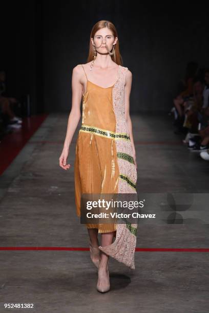 Model walks the runway during the Armando Takeda show at Mercedes Benz Fashion Week Mexico Fall/Winter 2018 at Fronton Mexico on April 26, 2018 in...