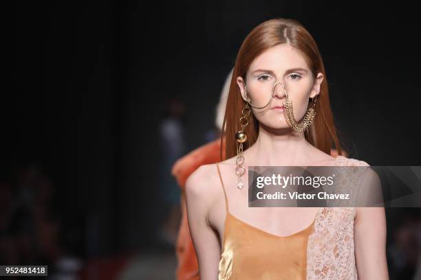 Model walks the runway during the Armando Takeda show at Mercedes Benz Fashion Week Mexico Fall/Winter 2018 at Fronton Mexico on April 26, 2018 in...