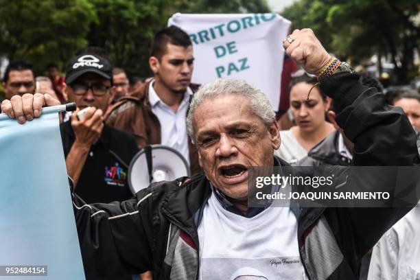 Social leaders from the Comuna 13 neighborhood chant slogans during a protest against the militarization and the lack of social programs in the...