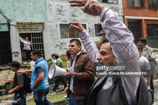 Social leaders from the Comuna 13 neighborhood chant slogans during a protest against the militarization and the lack of social programs in the...