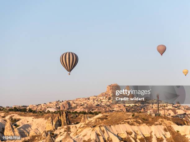 hot air balloon in cappadocia with uchisar castle - urgup stock pictures, royalty-free photos & images
