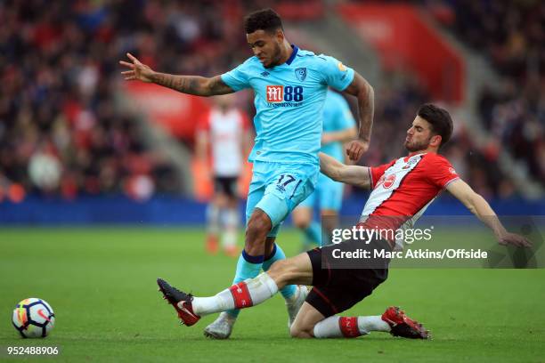 Joshua King of AFC Bournemouth in action with Wesley Hoedt of Southampton during the Premier League match between Southampton and AFC Bournemouth at...