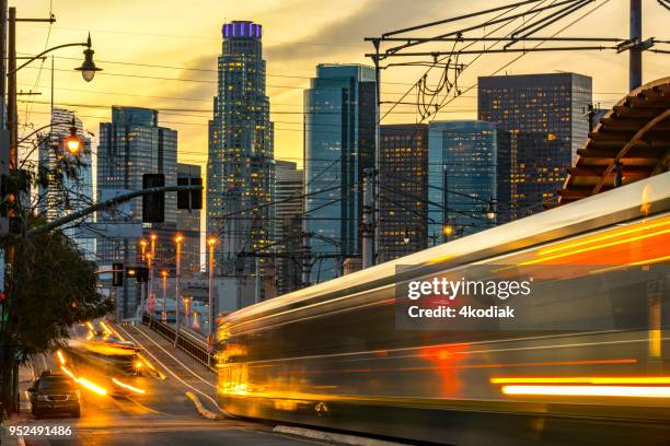 los angeles and traffic at dusk - train vehicle stock pictures, royalty-free photos & images