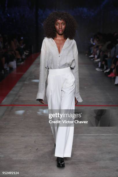 Model walks the runway during the Shinae Park show at Mercedes Benz Fashion Week Mexico Fall/Winter 2018 at Fronton Mexico on April 26, 2018 in...