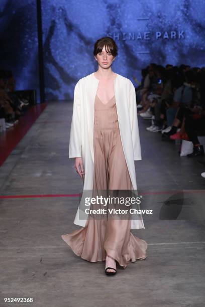 Model walks the runway during the Shinae Park show at Mercedes Benz Fashion Week Mexico Fall/Winter 2018 at Fronton Mexico on April 26, 2018 in...