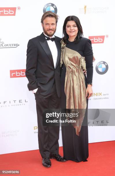 German actress Jasmin Tabatabai and her husband Andreas Pietschmann attend the Lola - German Film Award red carpet at Messe Berlin on April 27, 2018...