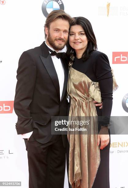 German actress Jasmin Tabatabai and her husband Andreas Pietschmann attend the Lola - German Film Award red carpet at Messe Berlin on April 27, 2018...