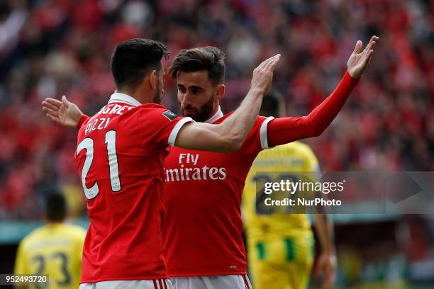 Benfica's forward Pizzi celebrates his goal with Benfica's midfielder Rafa Silva during the Portuguese League football match between SL Benfica and...