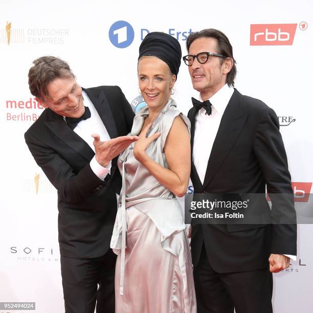 German actor Oliver Masucci, German actress Katja Riemann and director Oskar Roehler attend the Lola - German Film Award red carpet at Messe Berlin...