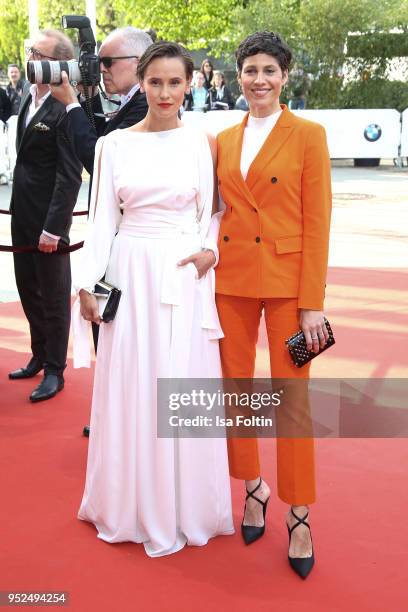 German actress Peri Baumeister and German actress Jasmin Gerat attend the Lola - German Film Award red carpet at Messe Berlin on April 27, 2018 in...