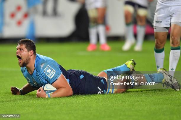 Montpellier's South African lock Paul Willemse reacts after scoring a try during the French Top 14 rugby union match between Montpellier and Pau on...