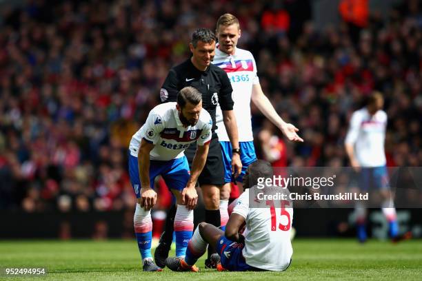 Erik Pieters of Stoke City talks with teammate Bruno Martins Indi during the Premier League match between Liverpool and Stoke City at Anfield on...