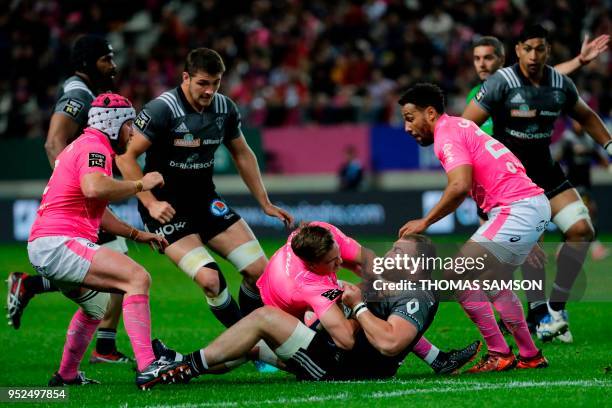Brive's Georgian prop Soso Bekoshvili vies with Stade Francais' French scrum-half Clement Daguin during the French Top 14 rugby union match between...