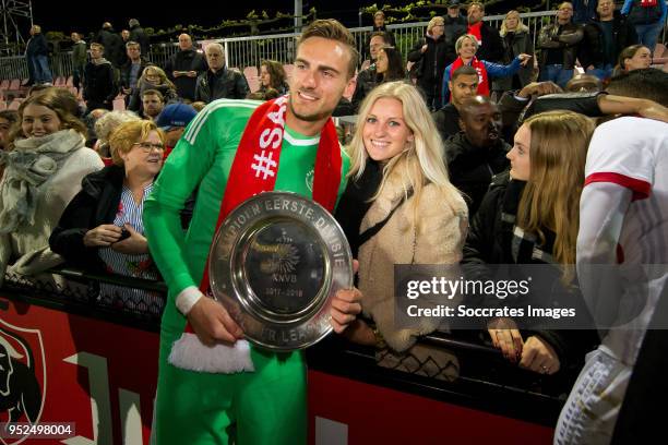 Peter Leeuwenburgh of Ajax U23 celebrates the championship with the trophy and his girlfriend during the Dutch Jupiler League match between Ajax U23...