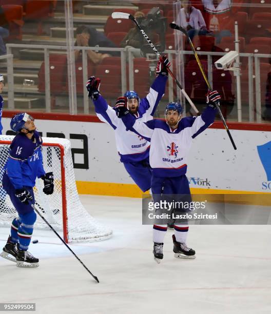 Brett Perlini of Great Britain celebrates his winning goal next to Robert Farmer of Great Britain and Jan Pavlu of Italy during the 2018 IIHF Ice...