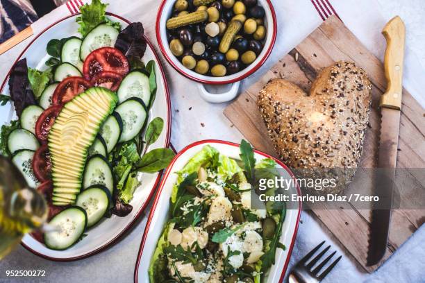 avocado and potato salads with grainy bread and olives - bread knife stock pictures, royalty-free photos & images