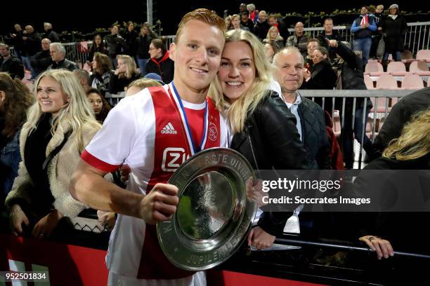 Dani de Wit of Ajax U23 celebrates the championship with the trophy and his girlfriend during the Dutch Jupiler League match between Ajax U23 v MVV...