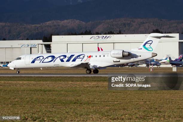 Bombardier CRJ-700 Adria airways at her home base in Ljubljana airport, Slovenia.
