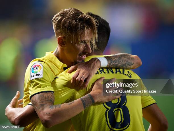 Samuel Castillejo of Villarreal celebrates with his teammate after scoring a goal during the La Liga match between Villarreal and Celta de Vigo at...