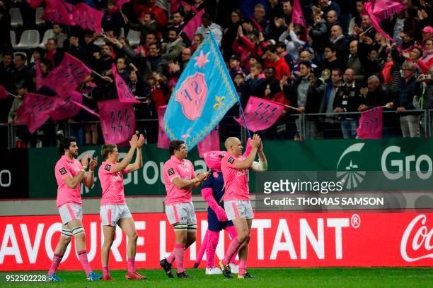 Stade Francais' players celebrate after they won the French Top 14 rugby union match between Paris Stade Francais and Brive CAB on April 28, 2018 at...