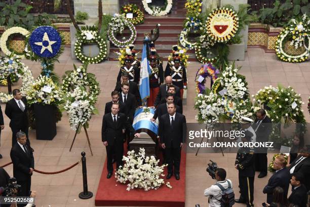 The frag-draped coffin of Guatemala City Mayor and former Guatemalan President Alvaro Arzu is escorted by his sons and grandchildren during a...