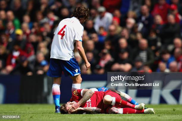 Joe Allen of Stoke City stands over Danny Ings of Liverpool during the Premier League match between Liverpool and Stoke City at Anfield on April 28,...