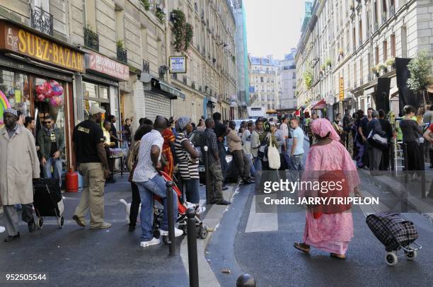 Immigrant people in Suez street, Goutte d Or district in 18 th arrondissement of Paris, Ile de France region, France.