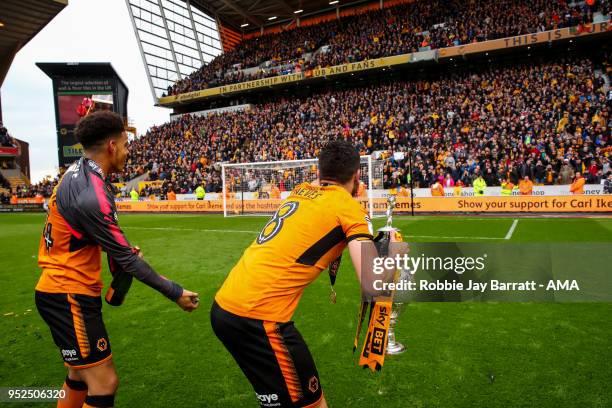 Ruben Neves of Wolverhampton Wanderers lifts the Sky Bet Championship trophy during the Sky Bet Championship match between Wolverhampton Wanderers...