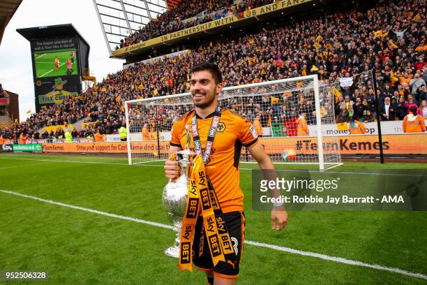 Ruben Neves of Wolverhampton Wanderers lifts the Sky Bet Championship trophy during the Sky Bet Championship match between Wolverhampton Wanderers...