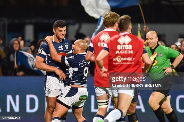Agen's flanker Pierre Fouyssac and Agen's South African scrumhalf, Enrico Januarie celebrate their team's last try during the French Top 14 rugby...
