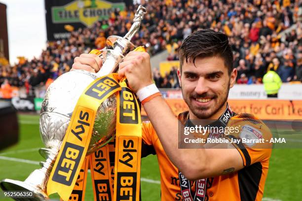 Ruben Neves of Wolverhampton Wanderers lifts the Sky Bet Championship trophy during the Sky Bet Championship match between Wolverhampton Wanderers...