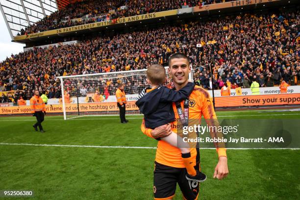 Conor Coady of Wolverhampton Wanderers celebrates with his son during the Sky Bet Championship match between Wolverhampton Wanderers and Sheffield...