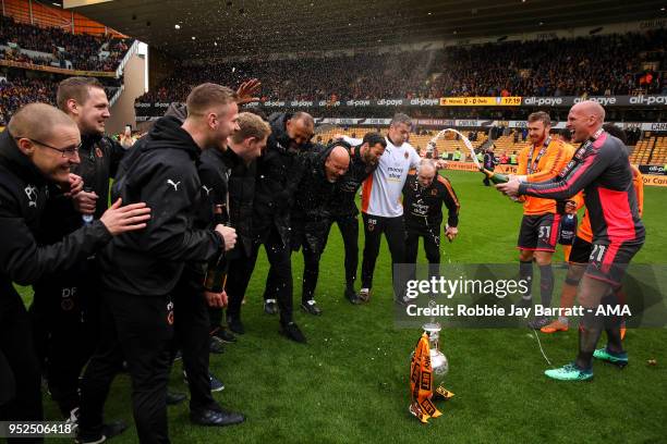 John Ruddy of Wolverhampton Wanderers sprays champagne on Nuno Espirito Santo head coach / manager of Wolverhampton Wanderers during the Sky Bet...