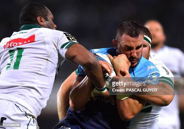 Montpellier's French flanker Louis Picamoles vies with Pau's Fijian wing Watisoni Votu during the French Top 14 rugby union match between Montpellier...