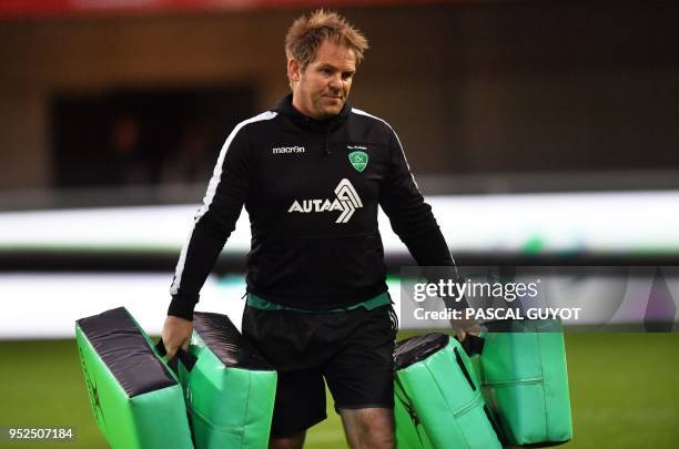 Pau's head coach, New Zealand's Simon Mannix holds training pads prior to the French Top 14 rugby union match between Montpellier and Pau on April...