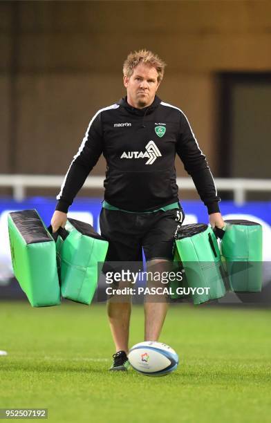 Pau's head coach, New Zealand's Simon Mannix holds training pads prior to the French Top 14 rugby union match between Montpellier and Pau on April...