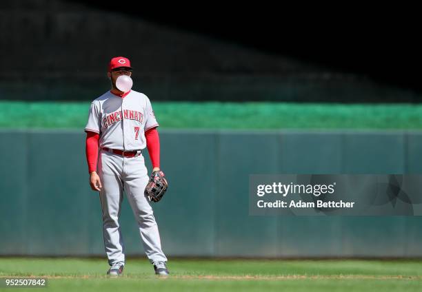 Eugenio Suarez of the Cincinnati Reds blows bubbles in the sixth inning against the Minnesota Twins at Target Field on April 28, 2018 in Minneapolis,...